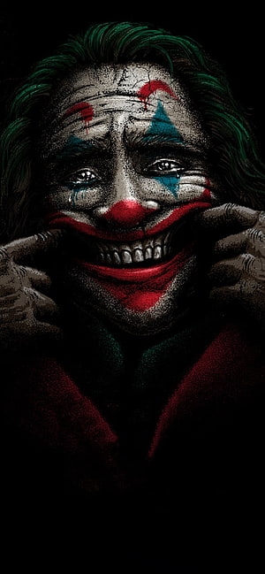 Dark and gritty illustration of the Joker character with green hair, smeared clown makeup, and a menacing wide grin HD phone wallpaper