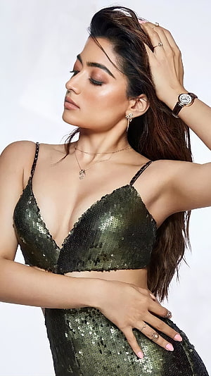 Pooja Hegde in a stunning dark green sequin two-piece ensemble posing elegantly with jewelry HD phone wallpaper