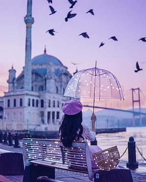 Girl with LED Umbrella Sitting on Bench in Istanbul at Sunset HD phone wallpaper