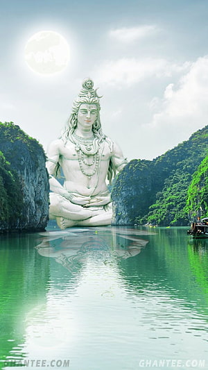 Giant Meditating Shiva Statue in Serene Lagoon with Moonlit Sky HD phone wallpaper