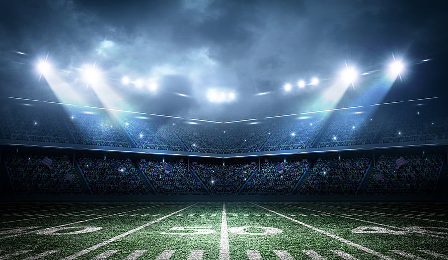 Dramatic Nighttime American Football Stadium With Bright Floodlights And Packed Crowd HD wallpaper