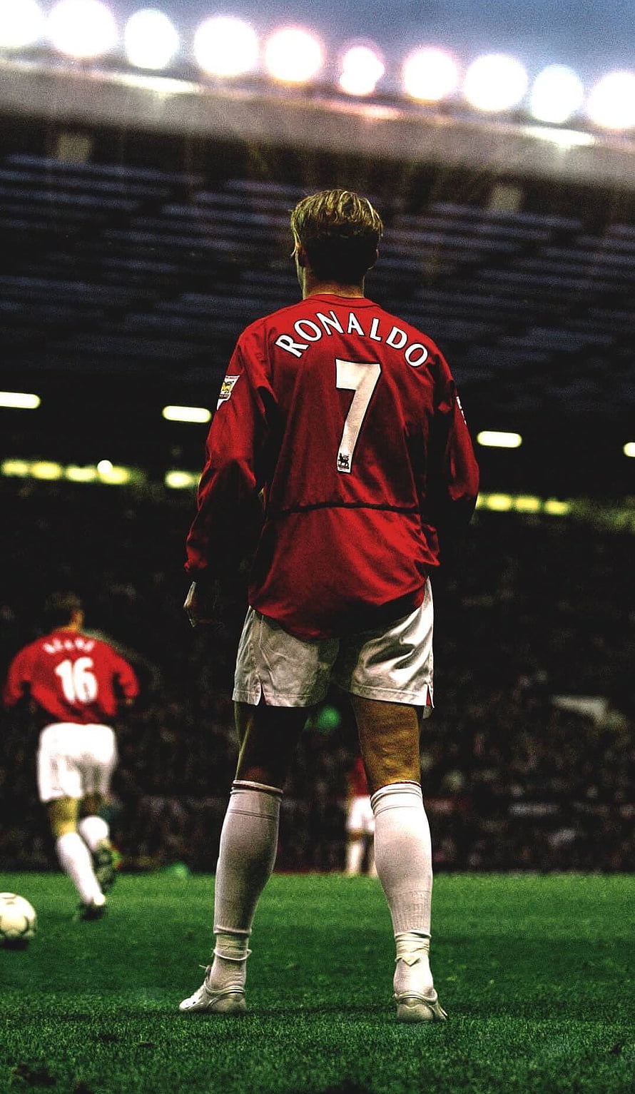 Ronaldo in Manchester United Red Kit Standing on the Pitch at Night HD phone wallpaper