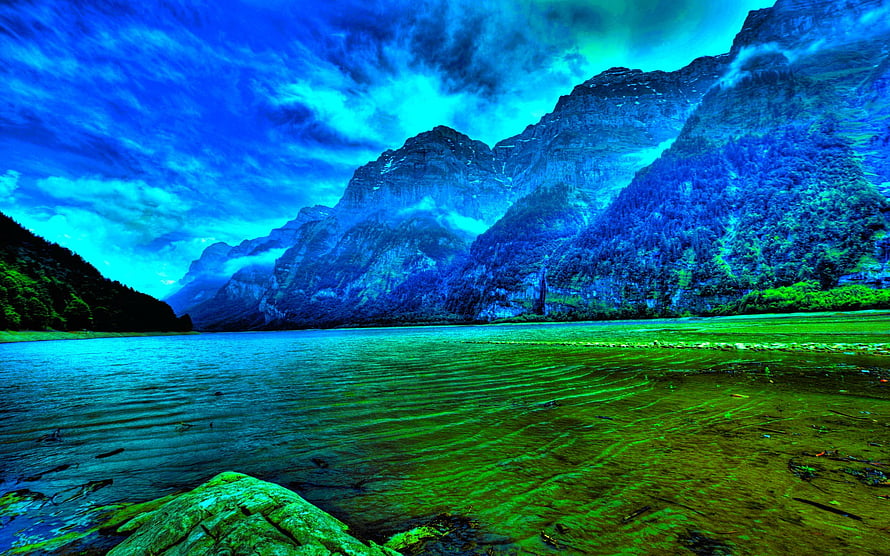 Vibrant Blue Mountain Lake Landscape with Dramatic Fog and Clouds HD wallpaper