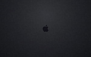 Minimalist Dark Apple Logo on Textured Fabric Background HD wallpaper