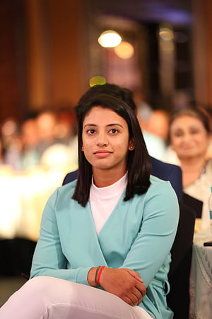 Smriti Mandhana in a light blue blazer at a formal awards ceremony HD phone wallpaper