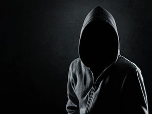 Mysterious Hooded Figure Silhouette in Dark Moody Atmosphere HD wallpaper