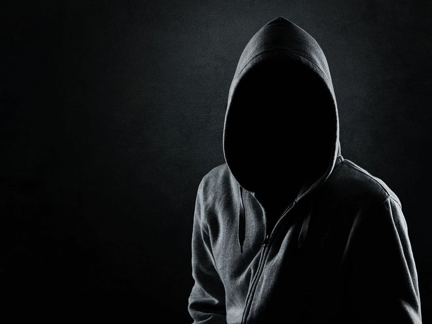 Mysterious Hooded Figure Silhouette in Dark Moody Atmosphere HD wallpaper