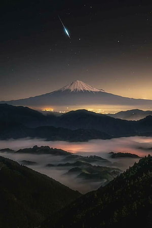 Mt Fuji at Night with Meteor and Starry Sky Over Misty Mountain Valleys in Japan HD phone wallpaper