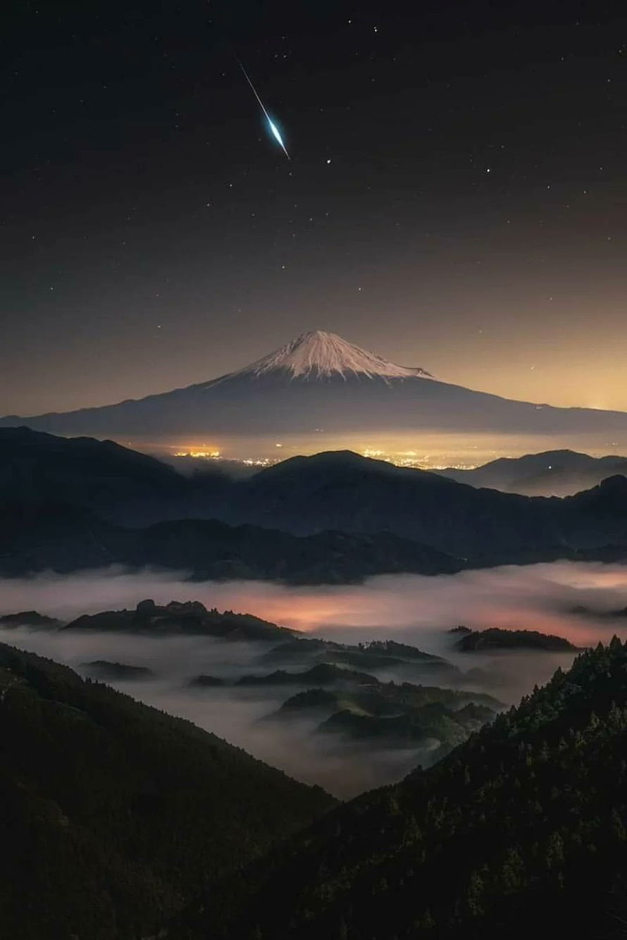 Mt Fuji at Night with Meteor and Starry Sky Over Misty Mountain Valleys in Japan HD phone wallpaper