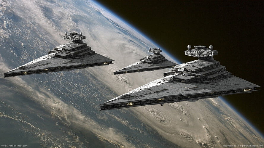 Star Wars Imperial Star Destroyers in Formation Over a Cloudy Planet HD wallpaper