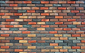 Multicolored Brick Wall Texture with Rustic Red, Brown, and Gray Tones HD wallpaper