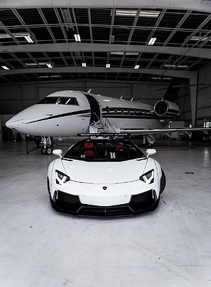White Lamborghini Aventador and Private Jet in Hangar HD phone wallpaper