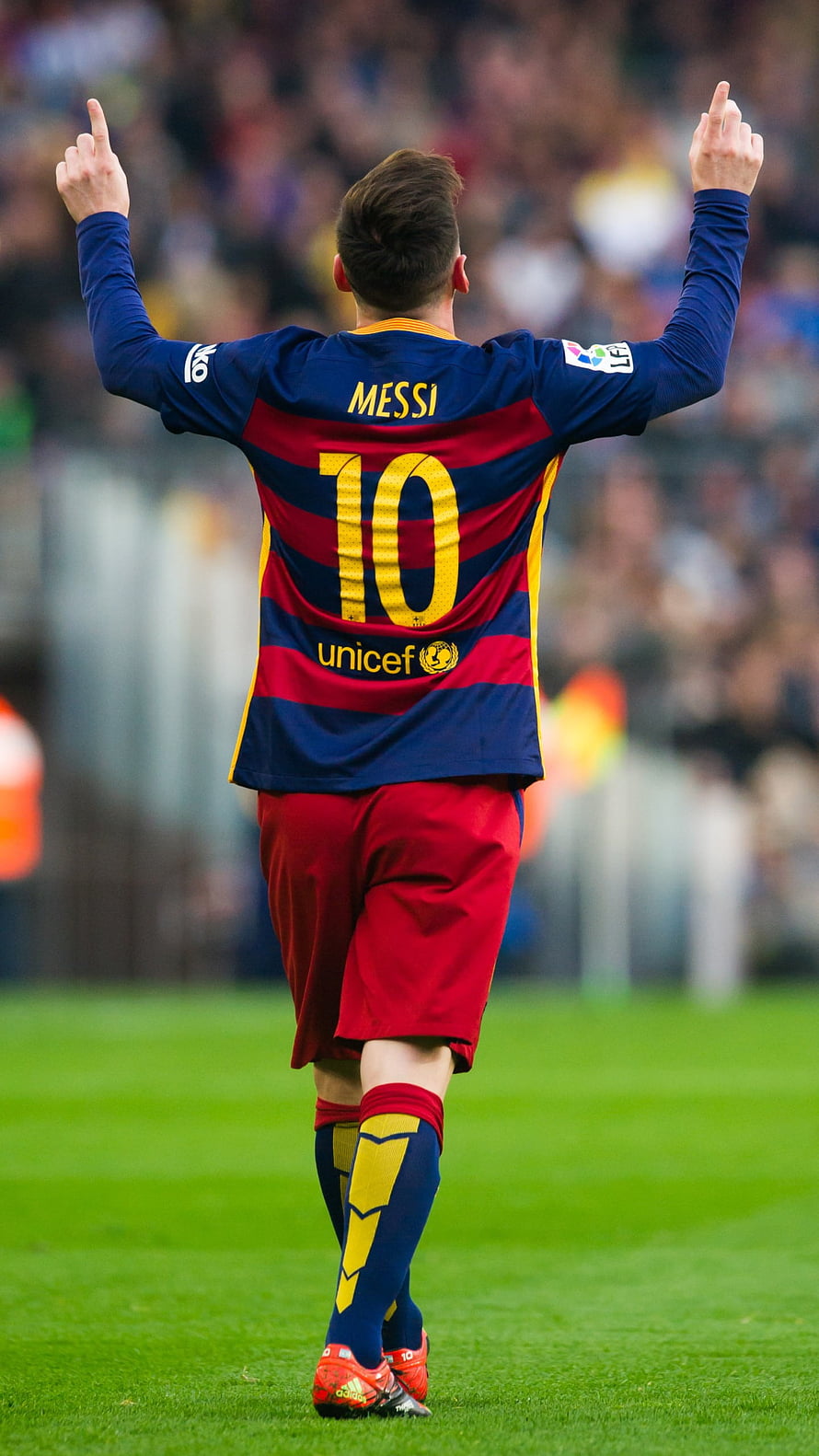 Lionel Messi in Barcelona Home Kit Celebrating on the Pitch HD phone wallpaper