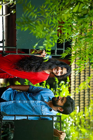 Romantic couple portrait on balcony with green foliage background, Premam, sai pallavi, nivin paully, happy HD phone wallpaper