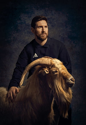 Lionel Messi Standing With a Goat in a Dark Studio Portrait HD phone wallpaper