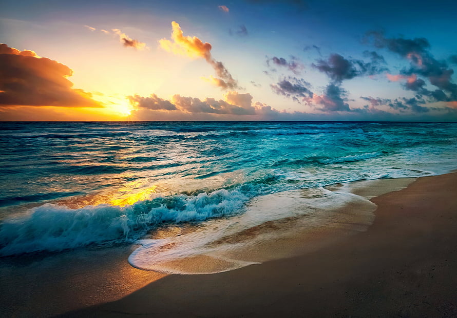 Serene Ocean Sunset With Golden Sunlight Reflecting On Turquoise Waves And Sandy Shore HD wallpaper