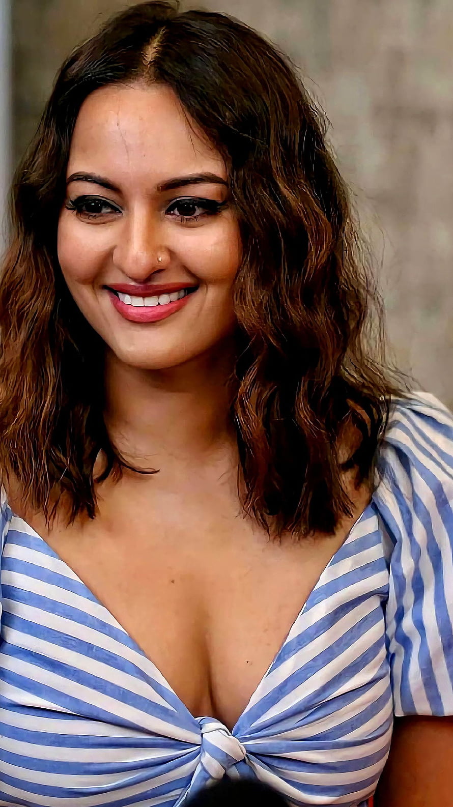 Sonakshi Sinha smiling portrait wearing a blue and white striped top HD phone wallpaper