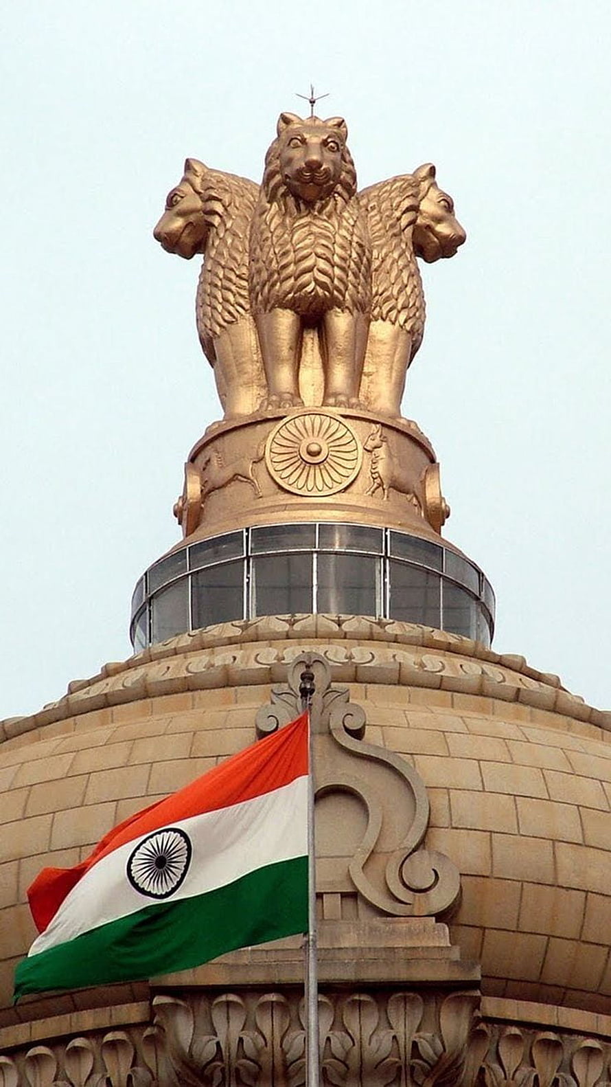 Golden Lion Capital of Ashoka atop the Indian Parliament Building with National Flag HD phone wallpaper