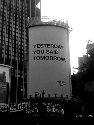 Black and white urban street scene featuring a Nike billboard with the slogan Yesterday You Said Tomorrow HD phone wallpaper