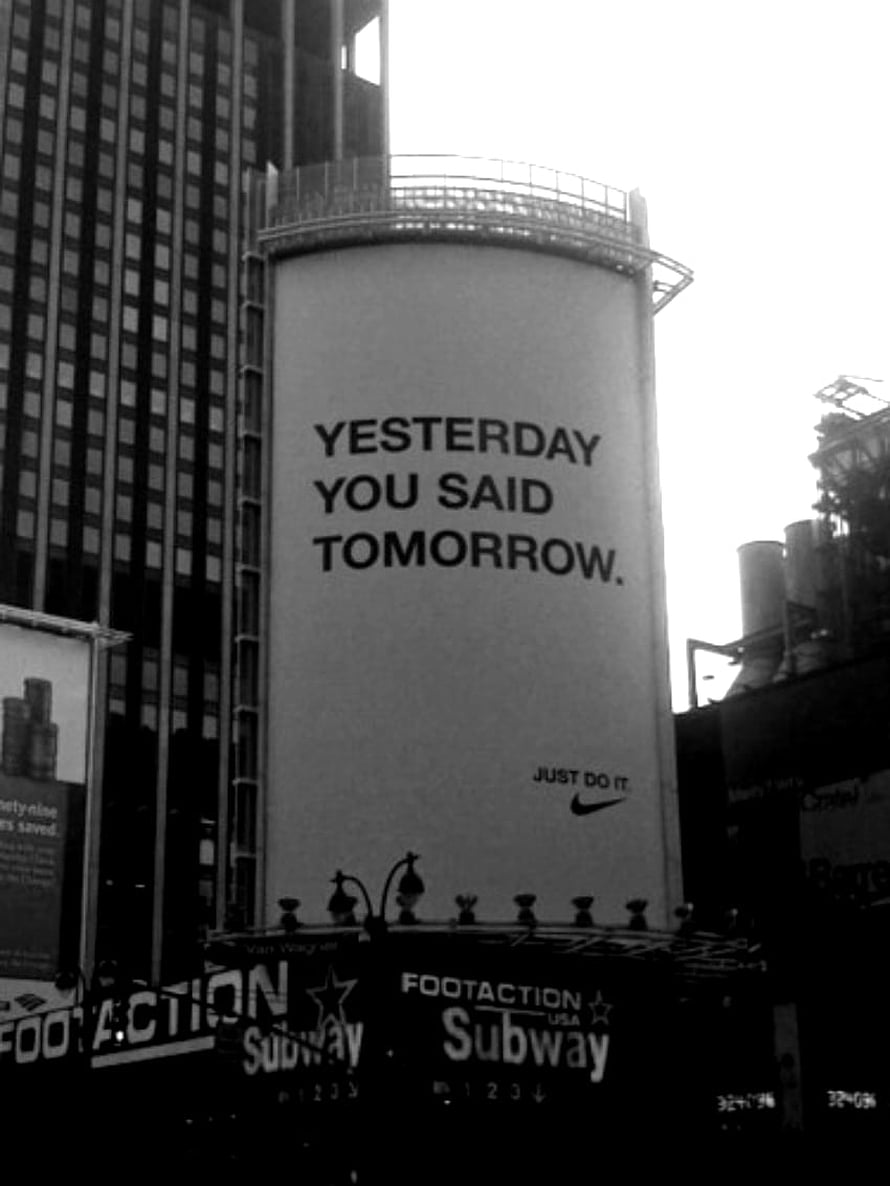 Black and white urban street scene featuring a Nike billboard with the slogan Yesterday You Said Tomorrow HD phone wallpaper