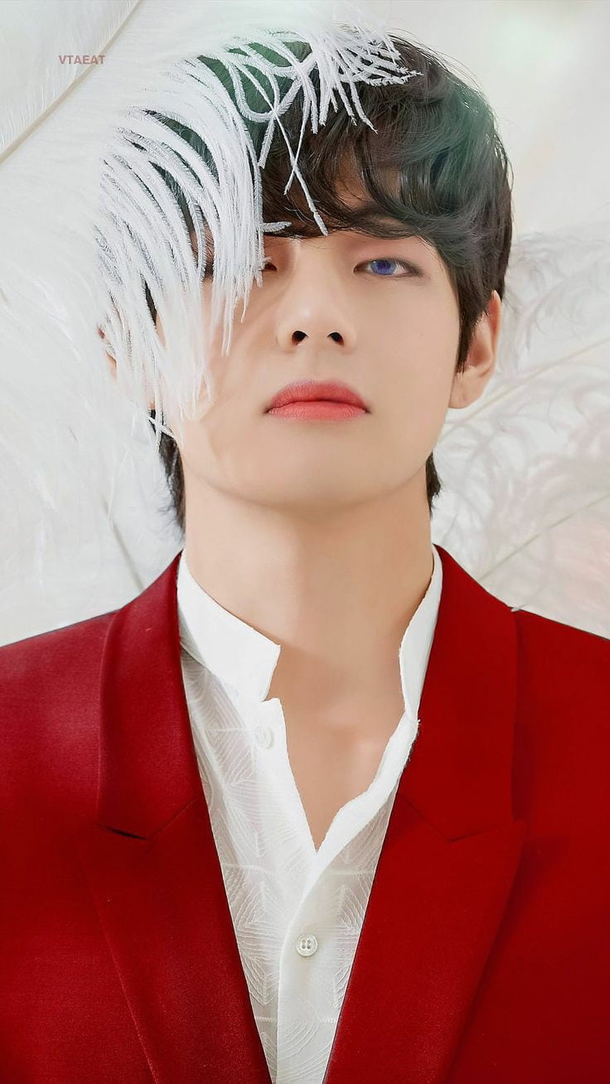 V from BTS in a striking red suit with white feather accents and green hair HD phone wallpaper
