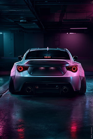 Rear View of a Toyota GT86 in a Neon-Lit Underground Parking Garage HD phone wallpaper