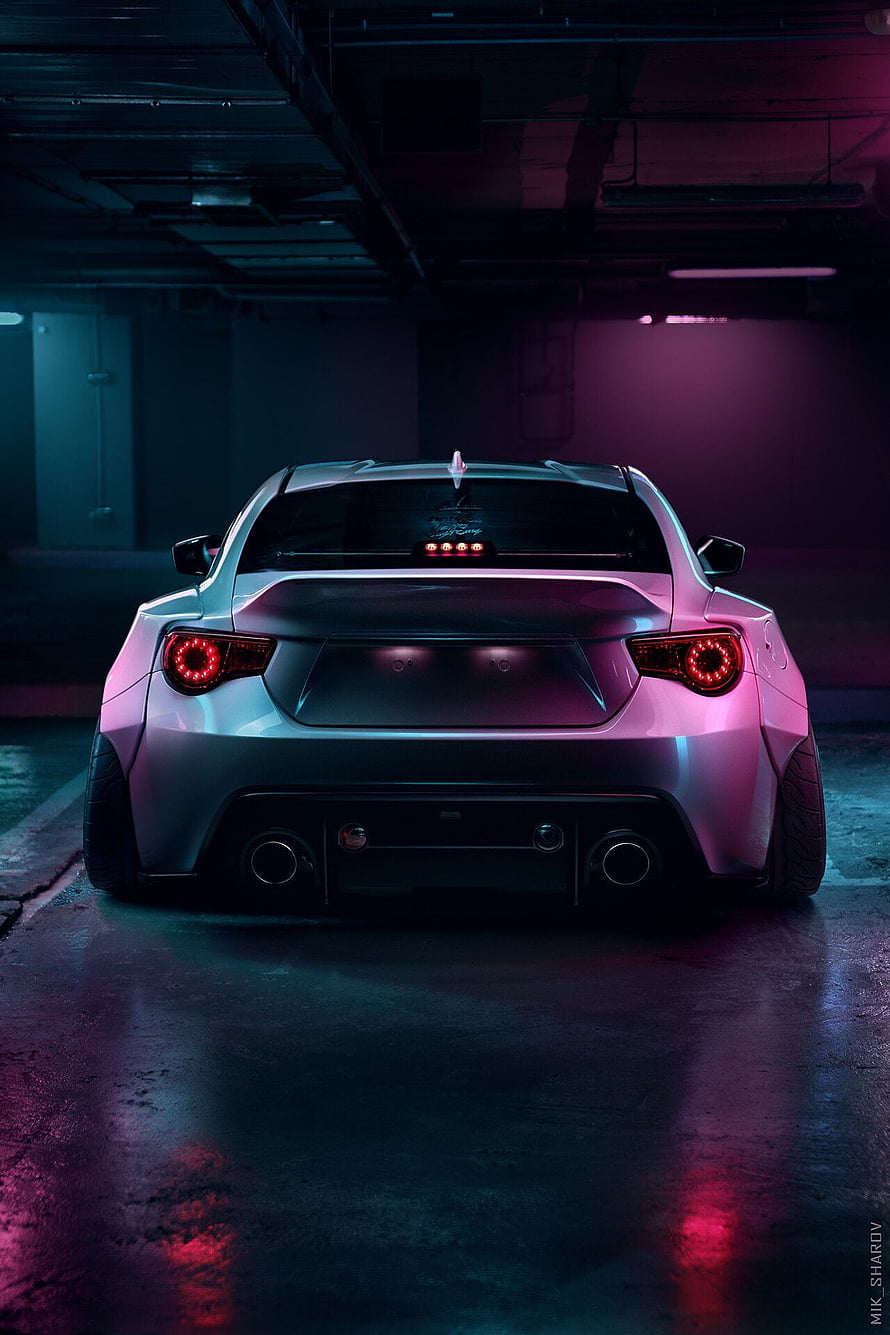 Rear View of a Toyota GT86 in a Neon-Lit Underground Parking Garage HD phone wallpaper