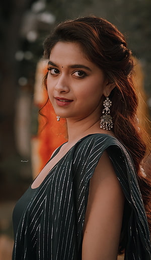 Adah Sharma in a stylish black striped saree with traditional silver jhumka earrings and a gentle smile HD phone wallpaper