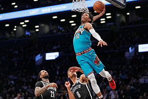 Ja Morant in action for the Memphis Grizzlies during an NBA game against the Brooklyn Nets HD wallpaper