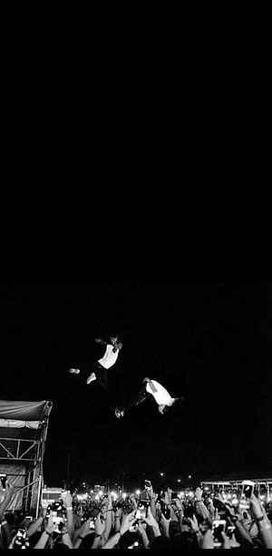 Playboi Carti Crowd Surfing at Night Concert in Black and White HD phone wallpaper