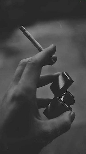 Monochrome Close-Up of Hand Holding Cigarette and Open Lighter HD phone wallpaper
