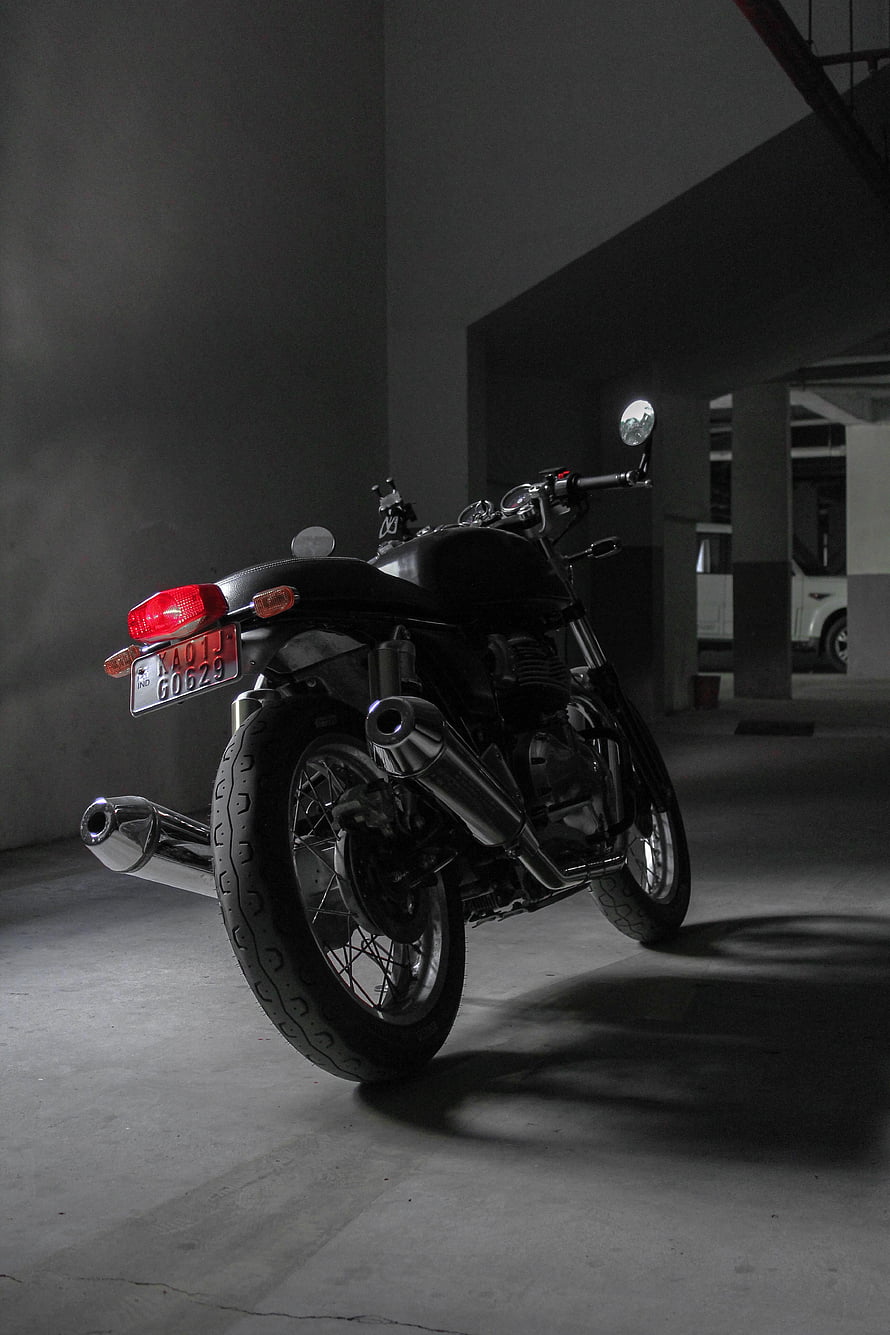 Royal Enfield Continental GT 650 Rear View in Dimly Lit Concrete Parking Garage HD phone wallpaper