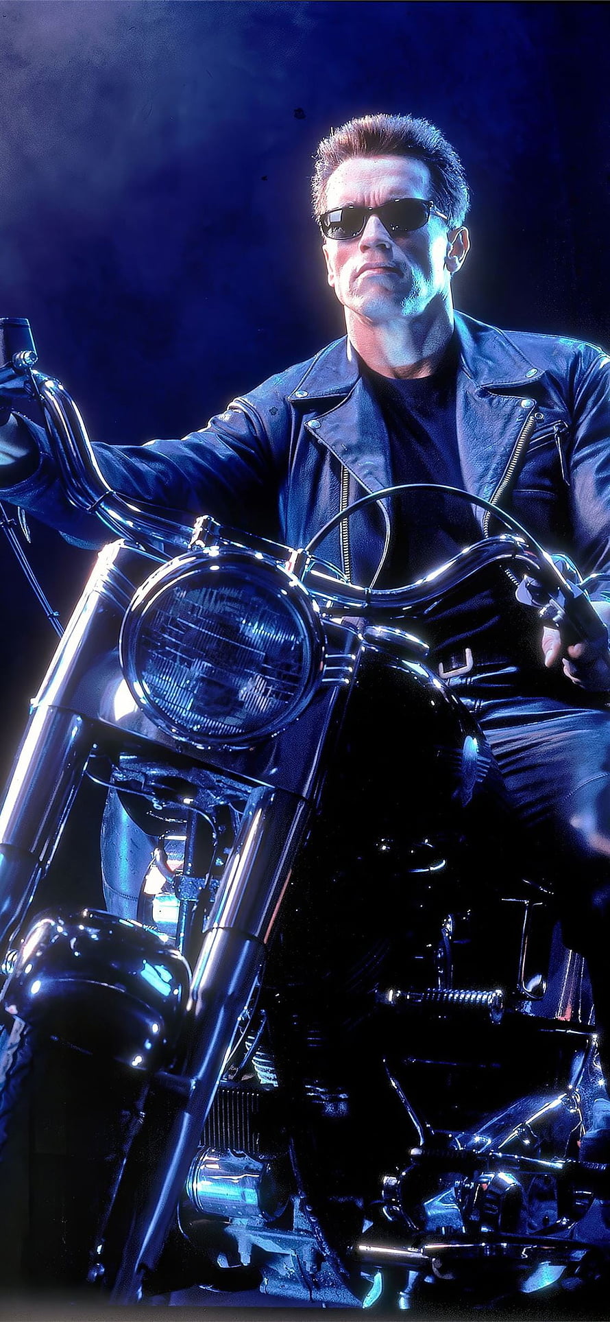 Arnold Schwarzenegger as The Terminator on a Chrome Motorcycle in a Dark Blue Setting HD phone wallpaper