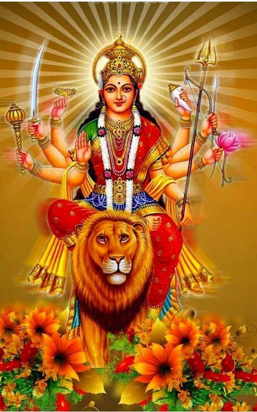 Maa Durga Riding Lion with Multiple Arms and Weapons in Golden Radiance HD phone wallpaper