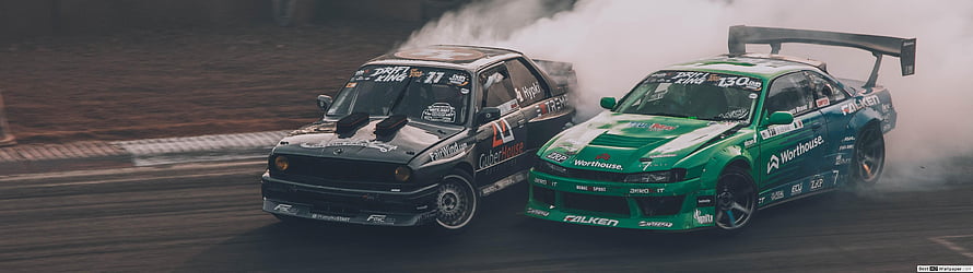 Two Modified Racing Cars Drifting Side by Side on a Track with Smoke HD wallpaper