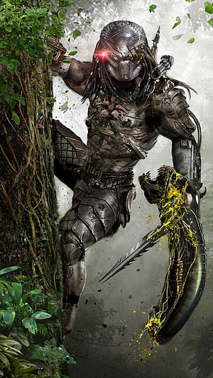 Predator warrior in jungle combat with alien trophy and glowing red visor HD phone wallpaper