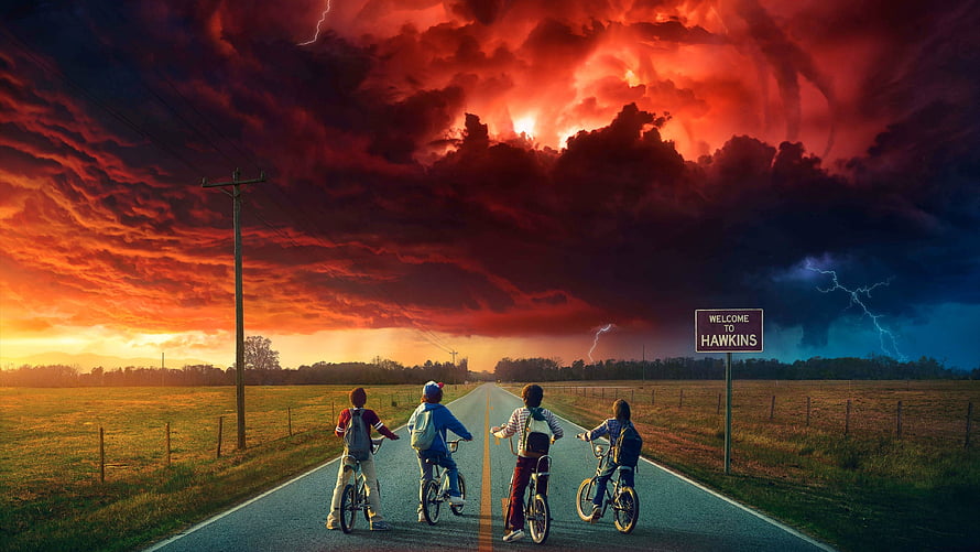 Stranger Things Four Boys Riding Bikes on Road Under Dramatic Red Storm Sky HD wallpaper