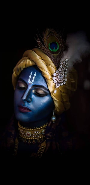 Krishna Portrait with Blue Face Paint, Golden Turban, and Peacock Feather HD phone wallpaper