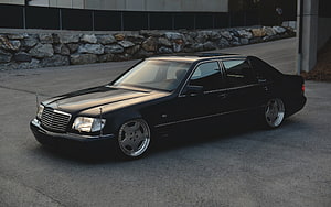 Black Mercedes-Benz W124 S-Class Sedan with Custom Wheels and Lowered Stance HD wallpaper