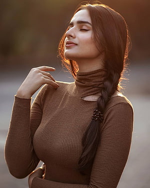 Ayesha Khan Portrait in Brown Turtleneck with Braided Hair and Golden Hour Lighting HD phone wallpaper