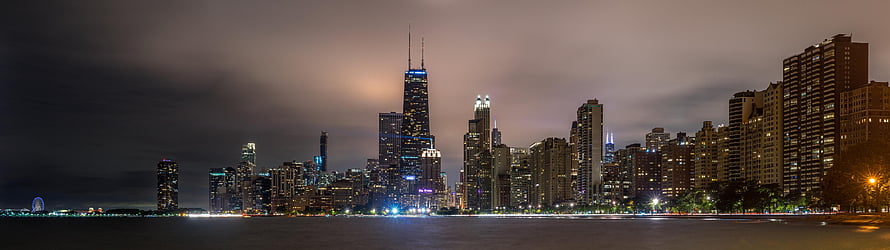 Chicago Skyline at Night with Lake Michigan and City Lights HD wallpaper