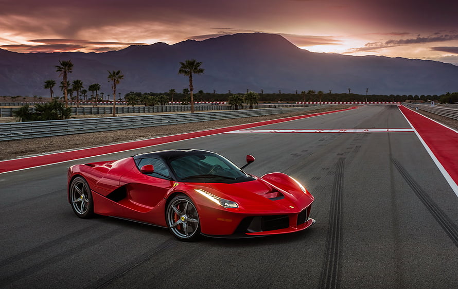 Red Ferrari LaFerrari Hypercar on a Desert Race Track at Sunset HD wallpaper
