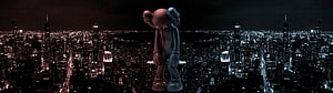 KAWS Companion Figure Standing Over a Dark New York City Night Skyline HD wallpaper