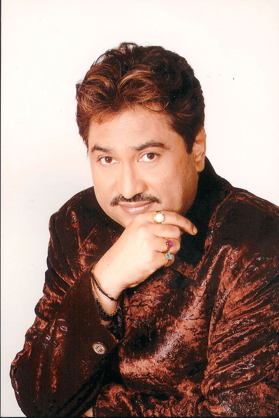 Kumar Sanu in a Brown Velvet Jacket with Gemstone Rings and a Thoughtful Pose HD phone wallpaper