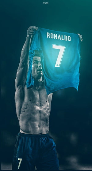 Cristiano Ronaldo Holding Up Number 7 Jersey in Dramatic Teal Lighting HD phone wallpaper