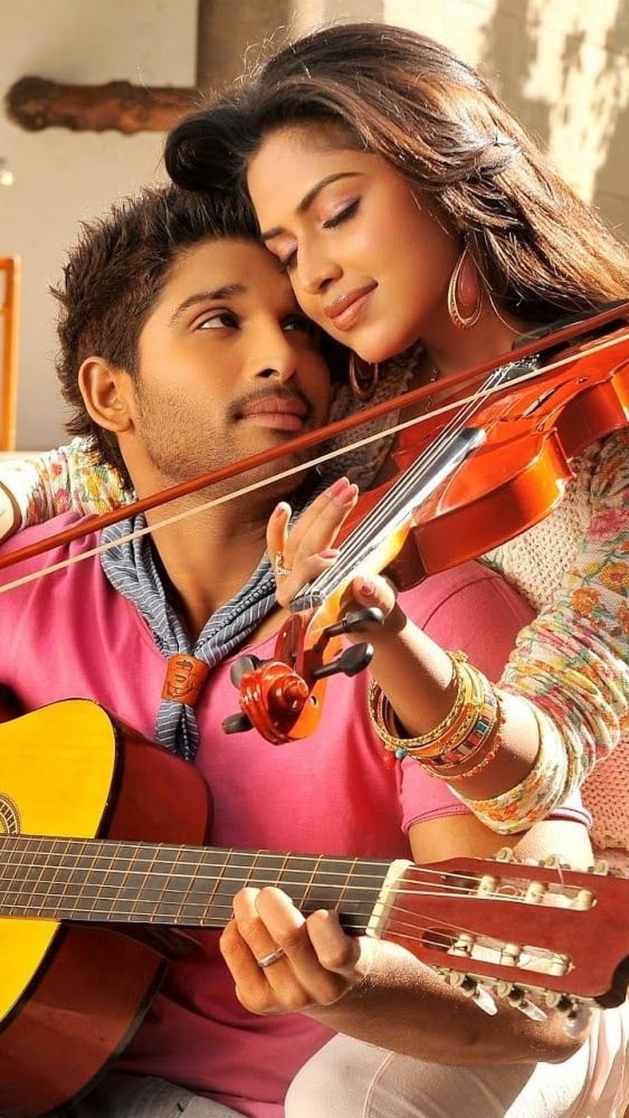 Allu Arjun and Female Co-Star in Intimate Romantic Scene with Guitar and Violin HD phone wallpaper
