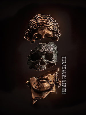 Apashe Skull Art: Three-Part Bronze and Stone Head Sculpture on Dark Background HD phone wallpaper