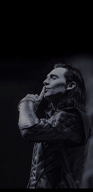 Tom Hiddleston as Loki in dramatic black and white stage portrait with finger to lips HD phone wallpaper