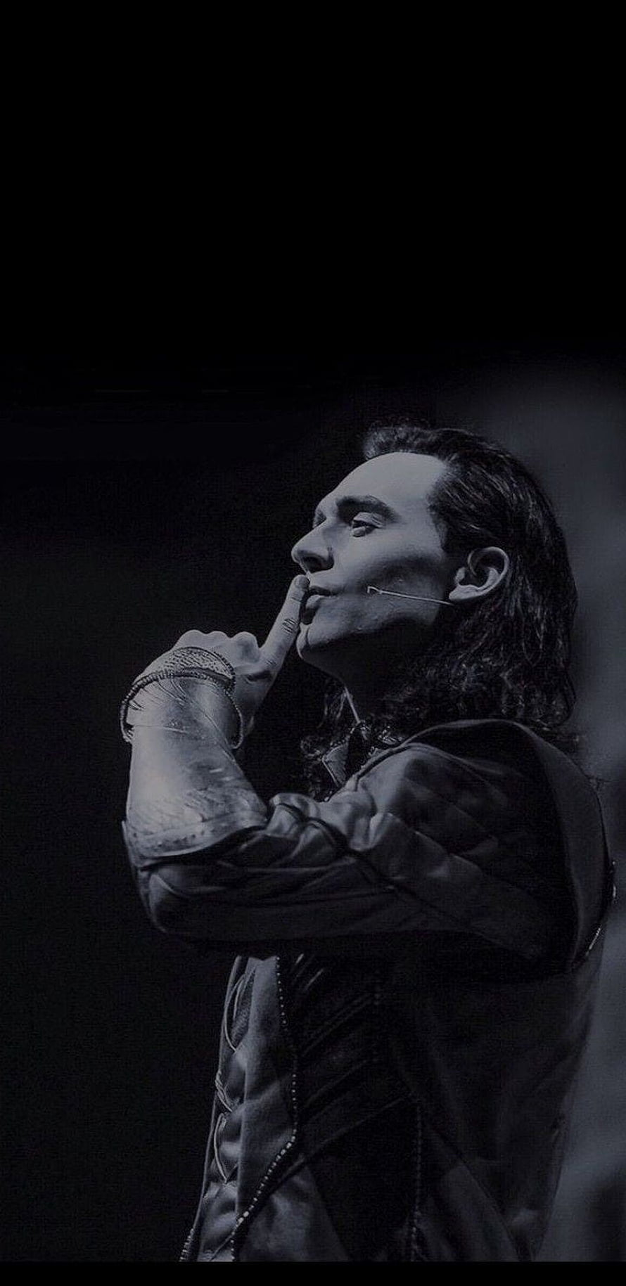 Tom Hiddleston as Loki in dramatic black and white stage portrait with finger to lips HD phone wallpaper