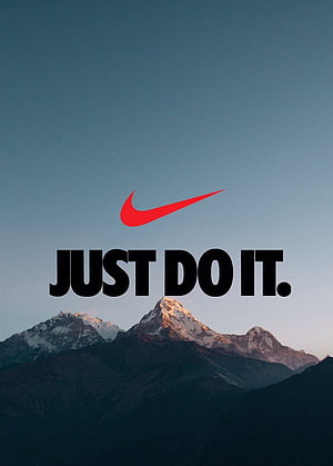 Nike Just Do It slogan with red swoosh logo above snow-capped mountain peaks at dusk HD phone wallpaper